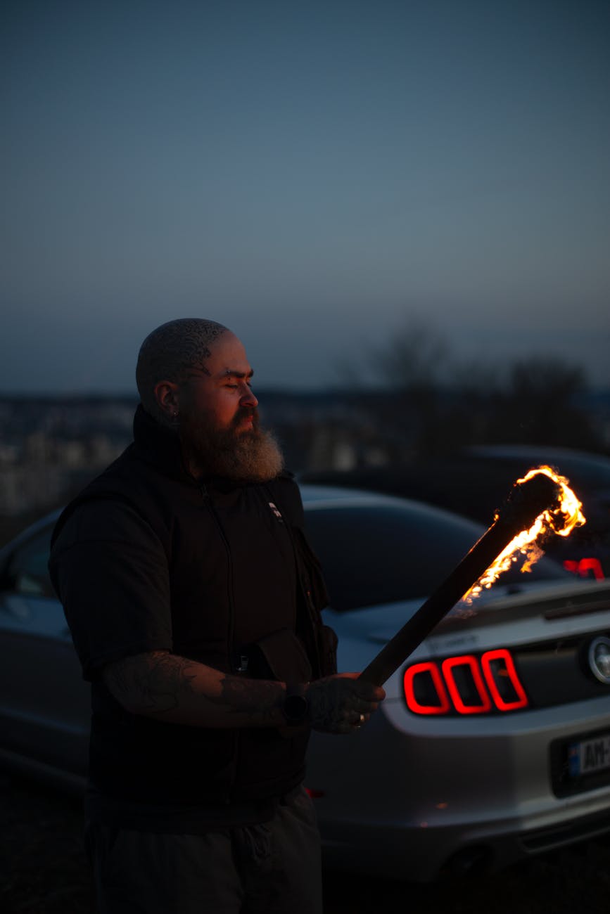 a man holding a burning torch